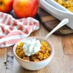 Bowl of southern sweet potato casserole with pecans and text overlay