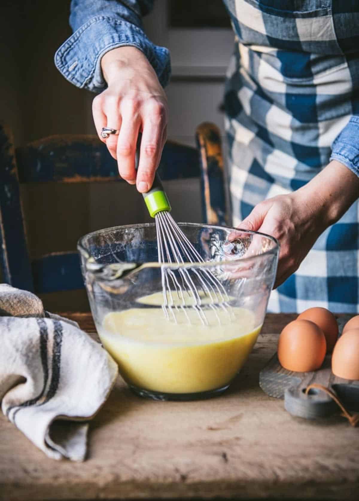 Process shot showing how to make mini egg bites