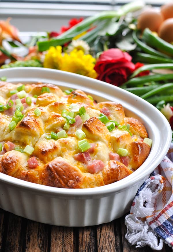 Baked Ham Egg and Cheese Monkey Bread in white casserole dish for brunch