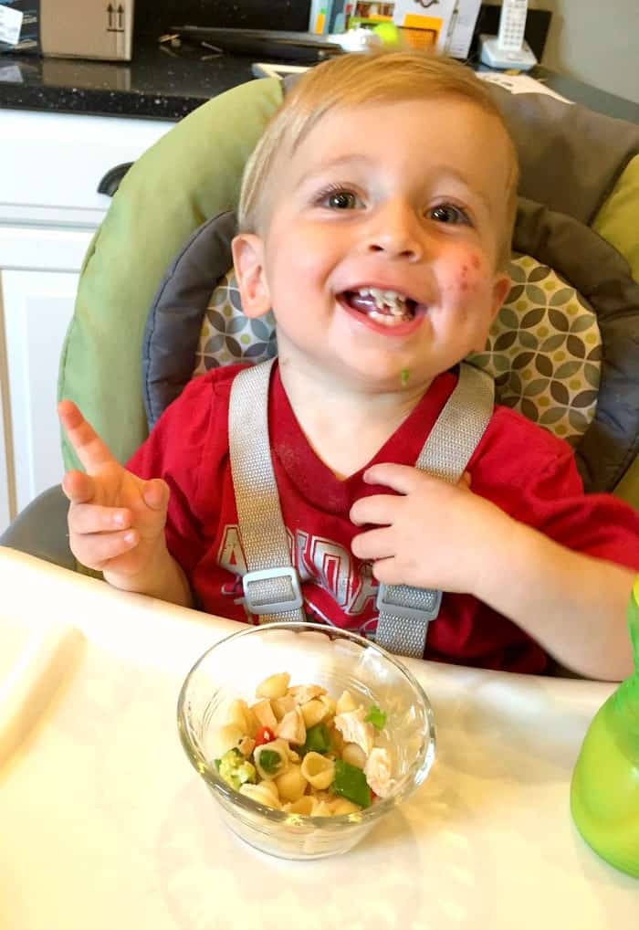 A boy Eating sesame chicken from a bowl