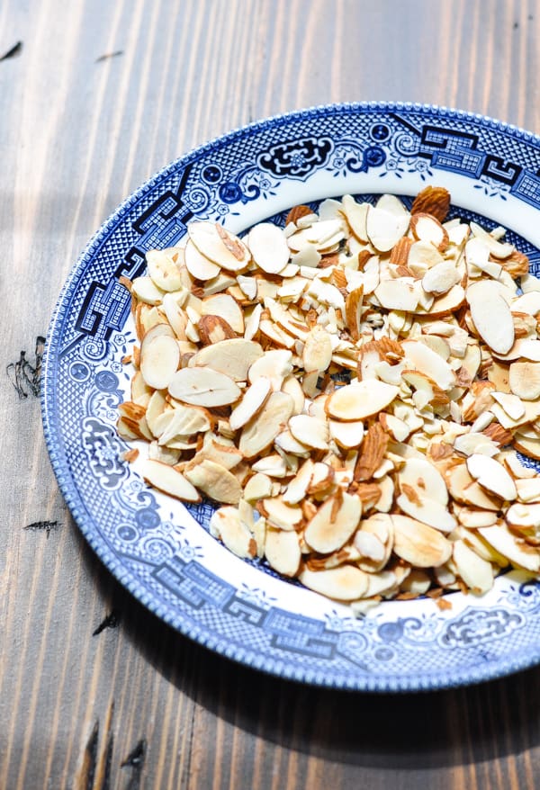 Sliced almonds toasted on a plate