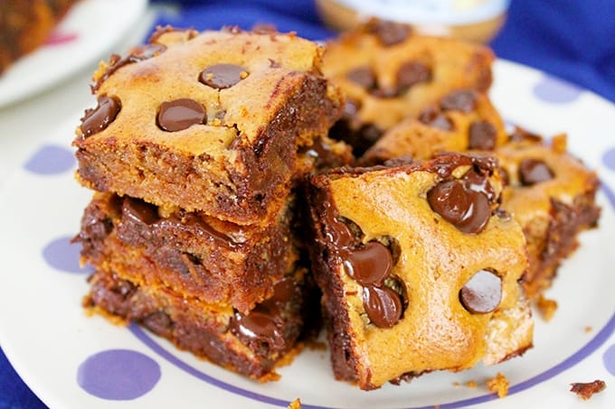 A stack of almond butter blondies with chocolate chips.