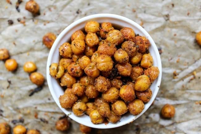 An overhead image of a ramekin dish filled with roasted cool ranch flavored chickpeas.