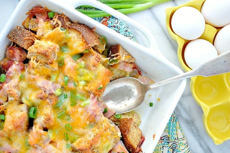 Ham Egg Cheese Breakfast Strata is an easy make-ahead brunch dish that's perfect for the holidays! Add this overnight breakfast casserole to your menu -- you will not be disappointed!