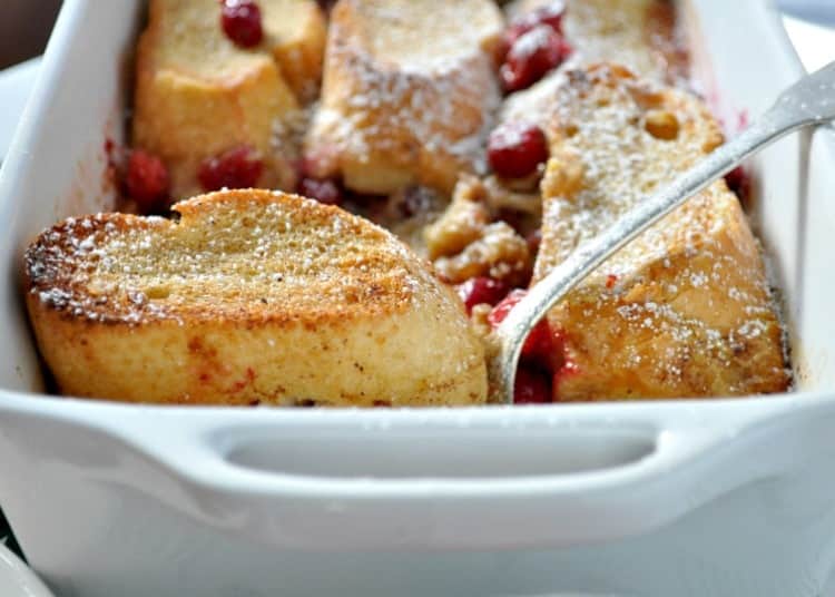 A close up shot of an overnight french toast casserole in a baking dish