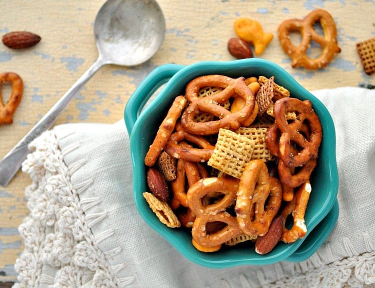 This Slow Cooker Mesquite Smokehouse Snack Mix is a salty, crunchy, and spicy easy appetizer for game day gatherings and festive holiday parties!