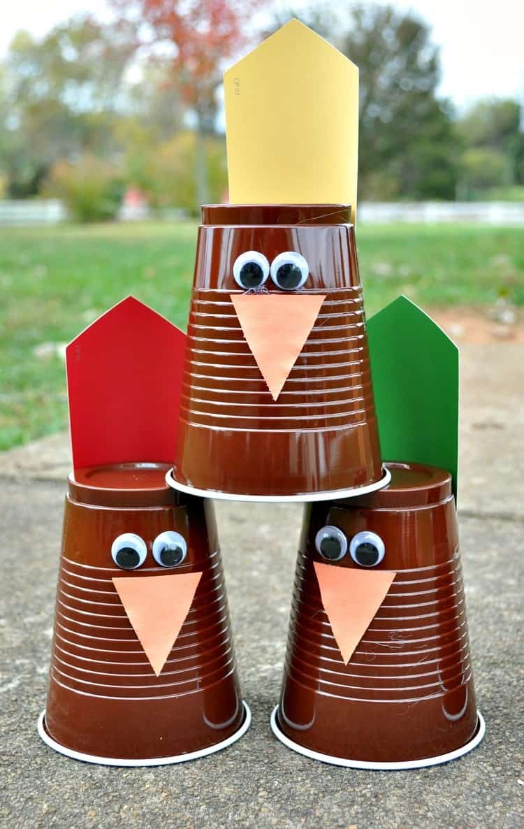 Stack of plastic cups for Turkey Bowling Thanksgiving Game for kids
