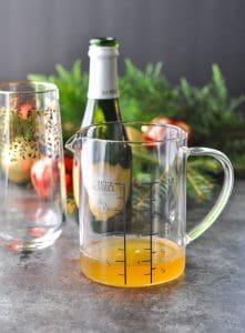 Ginger simple syrup in a glass measuring cup
