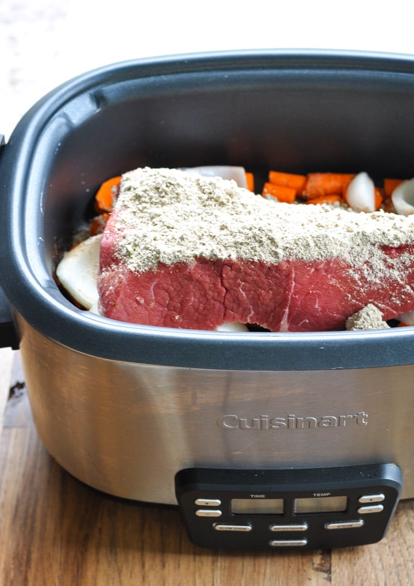 Pot roast and seasoning in slow cooker