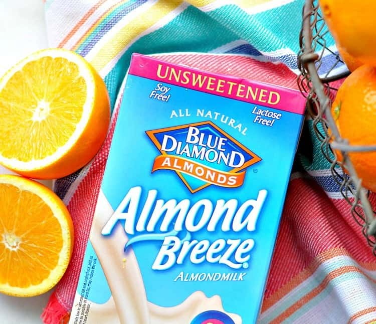 An overhead shot of almond breeze almond milk used to make an orange smoothie