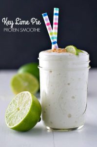 A close up of an easy key lime pie smoothie with straws