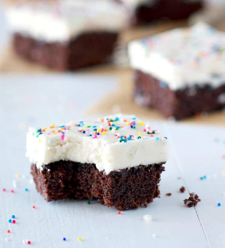 A few simple additions to a boxed brownie mix create the most decadent, festive, and EASY Derby Day Bourbon Brownies! The moist, rich brownies are spiked with Kentucky bourbon whiskey and then topped with a creamy layer of bourbon frosting for a perfectly boozy party dessert!