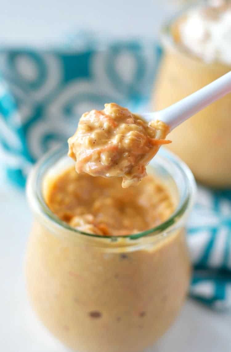A close up of carrot cake overnight oats on a spoon