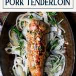 Whole oven roasted pork tenderloin in a roasting pan with text title box at top.