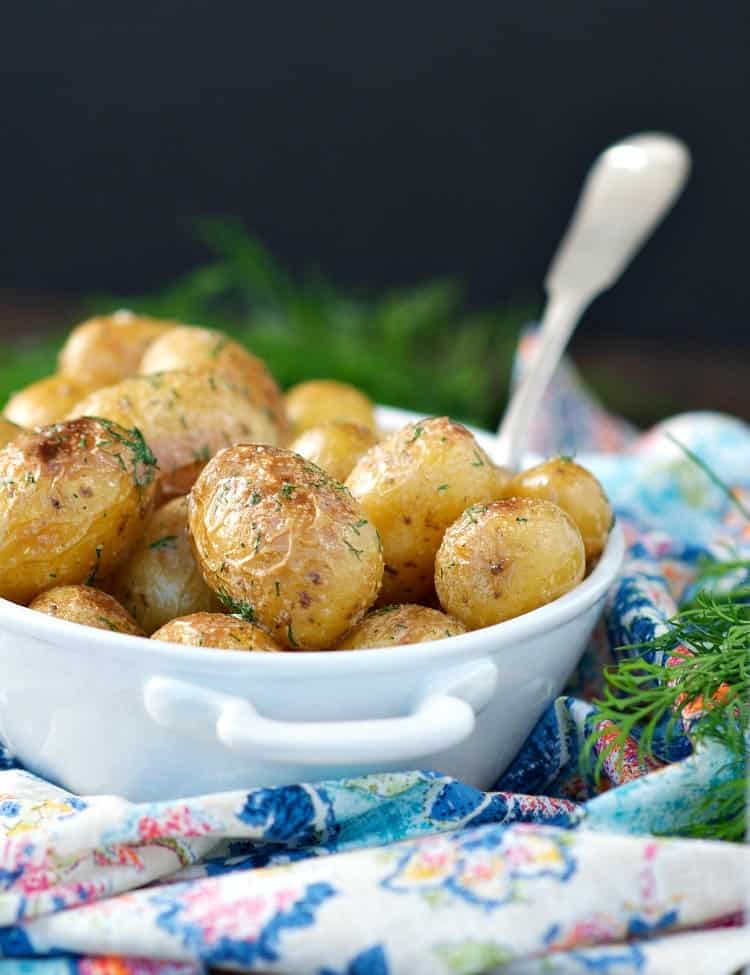 Simple is usually best, and these Buttered Dilly New Potatoes are no exception! Just 5 minutes of prep time results in the perfect side dish -- crispy, tender potatoes that are lightly dressed in butter, garlic, salt, and fresh herbs!
