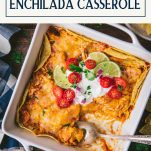 Overhead shot of an easy chicken enchilada casserole on a wooden table with text title box at top.
