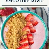 Strawberry cheesecake smoothie bowl with text title box at top.