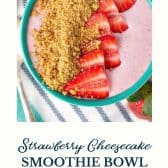 Strawberry cheesecake smoothie bowl with text title at the bottom.