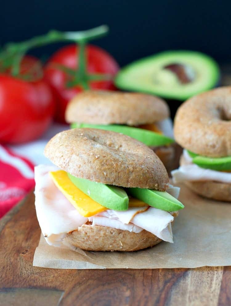 A picnic sandwiched filled with avocado and ham and cheese