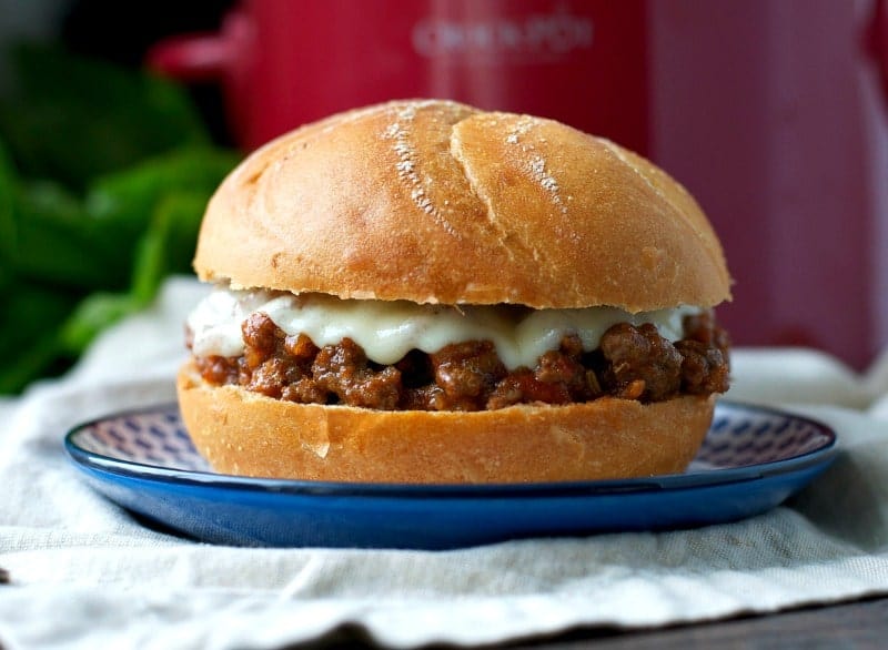 A close up of slow cooker sloppy joes on a blue plate