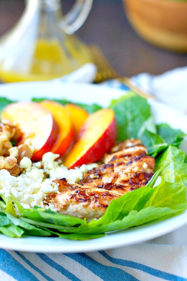 Close up front shot of grilled chicken salad with nectarines