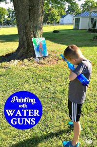 Painting with Water Guns is fun target practice activity for kids!