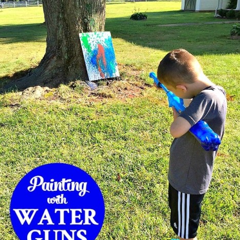 Painting with Water Guns is fun target practice activity for kids!