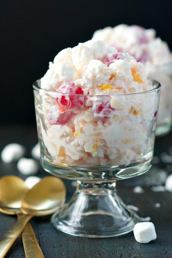 Front shot of ambrosia salad recipe in a glass serving dish
