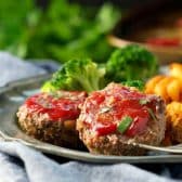 Square side shot of a plate of healthy mini meatloaf.