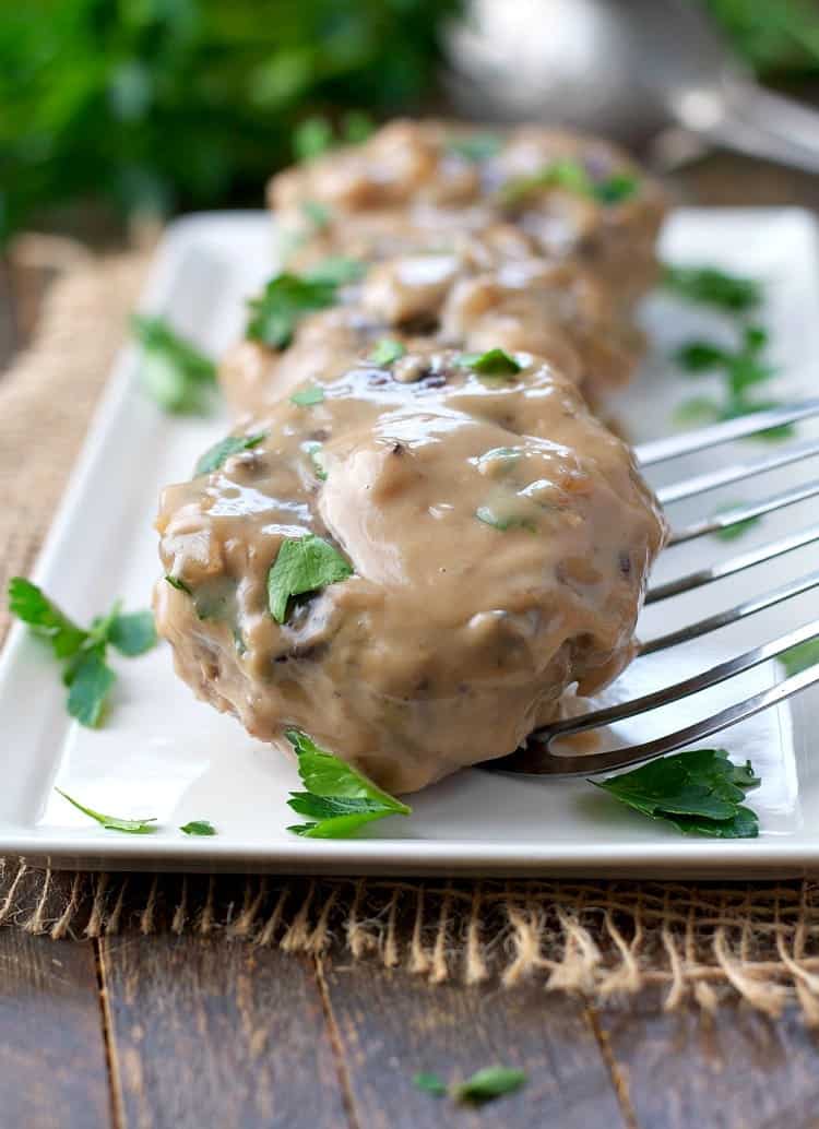 This Salisbury Steak is classic comfort food! The healthy recipe can be prepared in the slow cooker or baked in the oven for an easy dinner on busy nights!