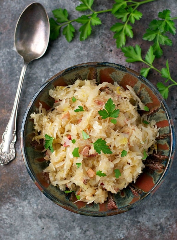 Sauerkraut recipe served in a bowl on a gray surface