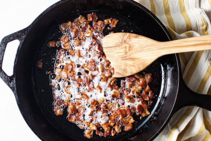 Frying bacon in.a cast iron skillet.