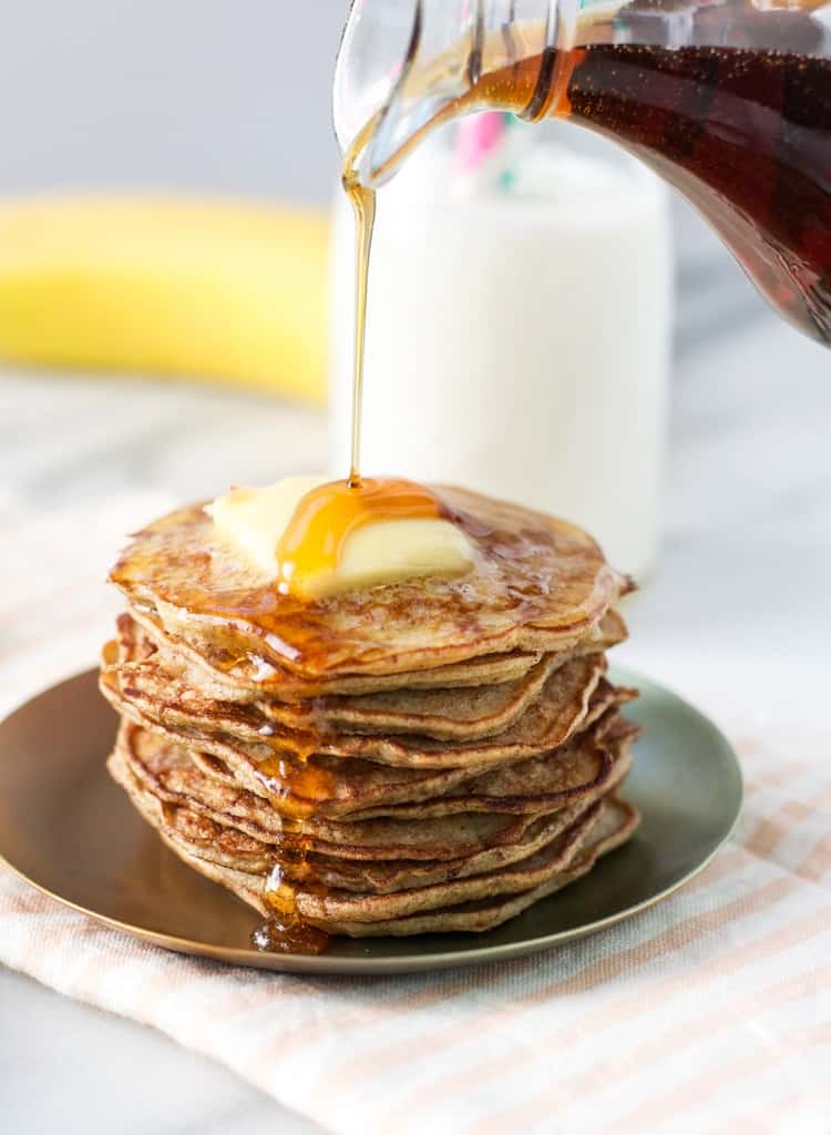 A stack of flourless grain free and gluten free 3 ingredient healthy banana pancakes make kids smile!