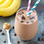 Healthy Chunky Monkey Protein Smoothie with bananas and peanut butter and chocolate chips on the table