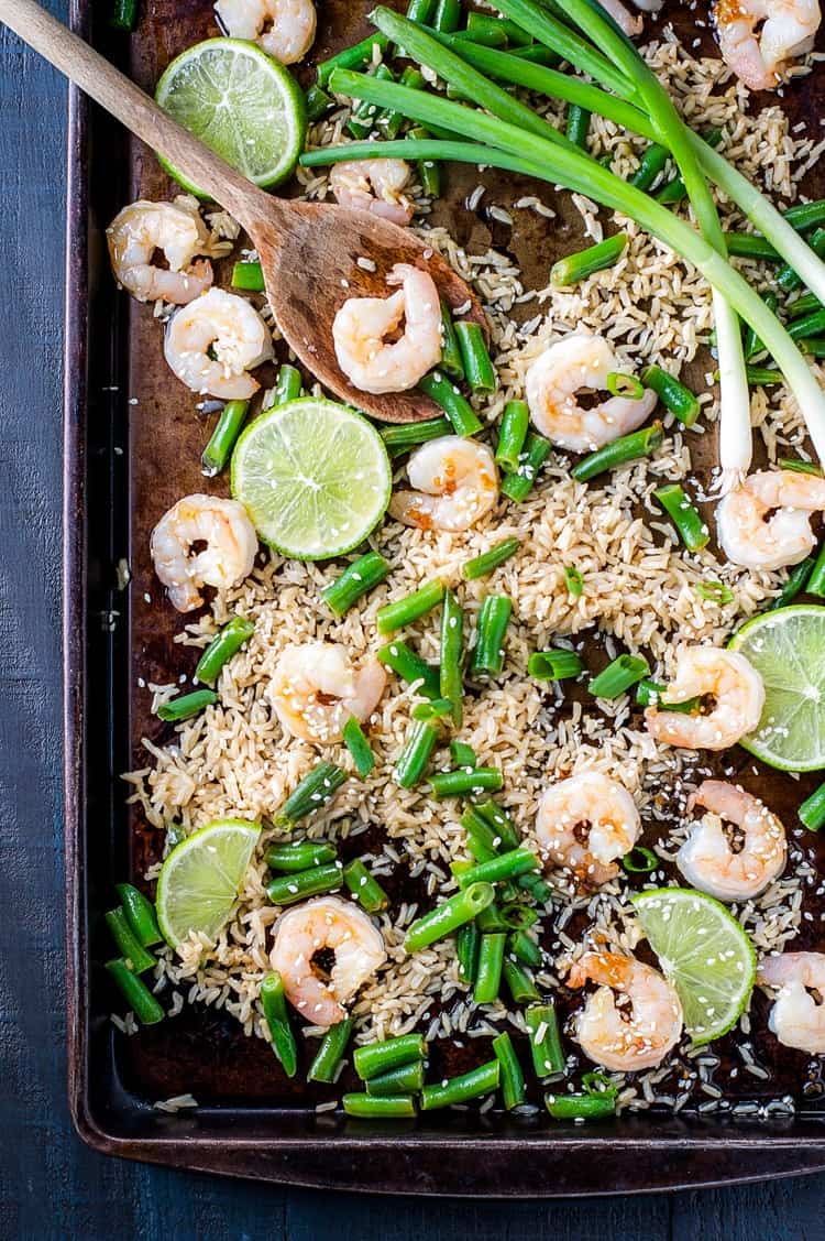 An overhead shot of  Honey Garlic Shrimp with Rice and Green Beans on a sheet pan