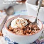 A close up image of healthy baked oatmeal in a bowl topped with cream