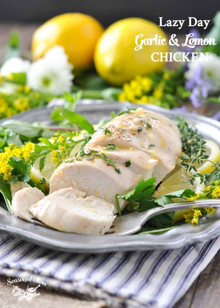 Garlic and lemon chicken on a plate, cut into slices