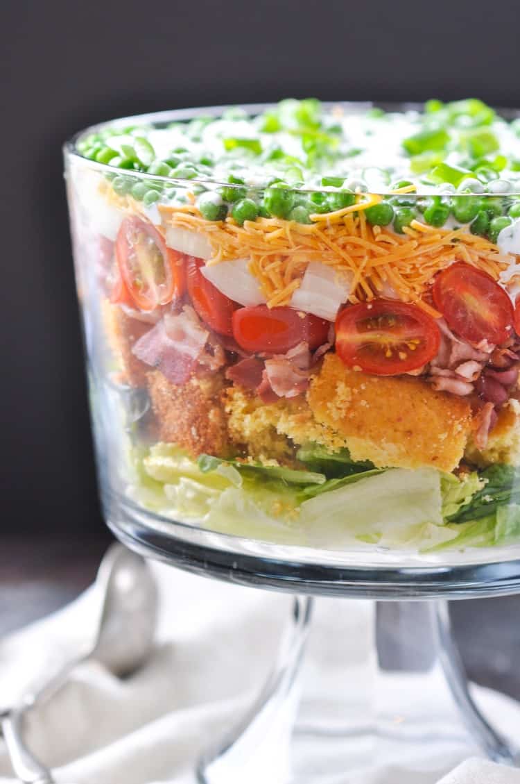 A close up of a side shot of a layered southern cornbread salad