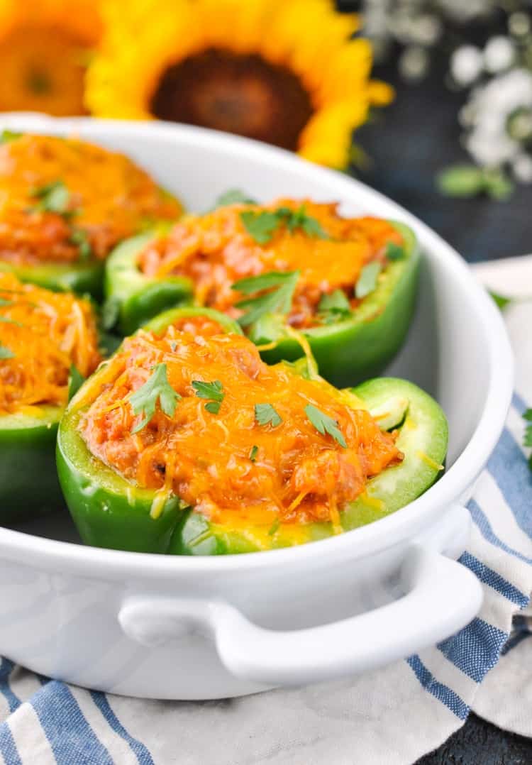 A close up of Amish stuffed green peppers in a white dish