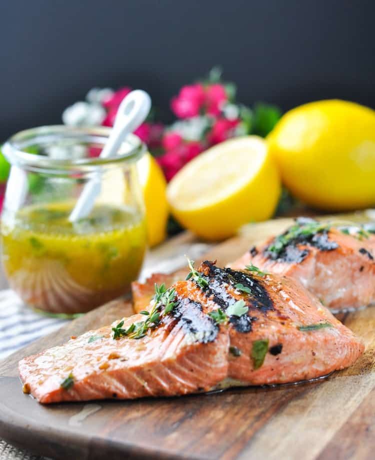 Garlic and herb salmon marinade on a wooden board