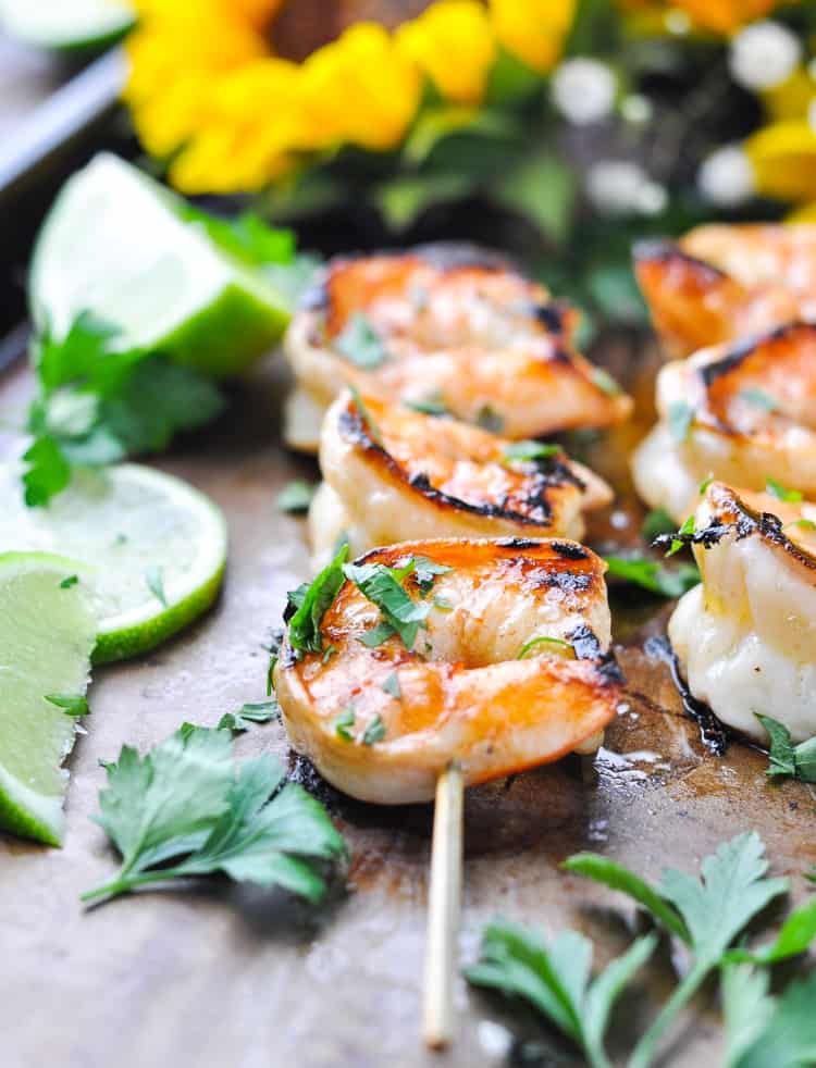 Marinated grilled shrimp on a wooden skewers