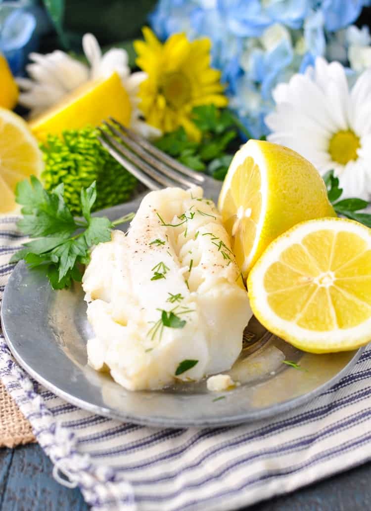 A fillet of garlic lemon cod on a plate