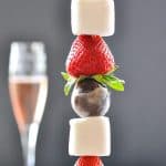 Close image of Strawberry Chocolate Donut Kabobs with pink rose in the background