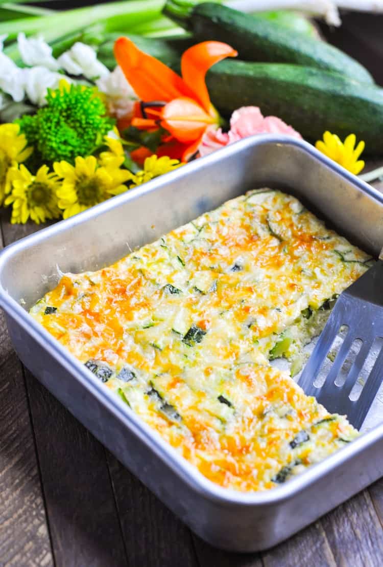 A photo of a baked zucchini omelet in a baking dish, easy zucchini recipes