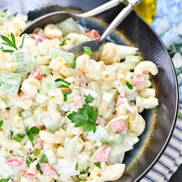 Close up image of old fashioned Southern Macaroni Salad in a ceramic serving bowl