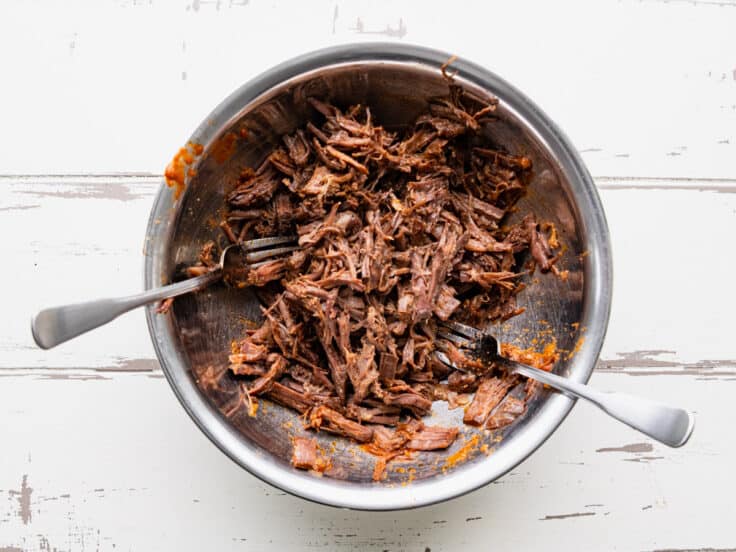 Shredding the beef.
