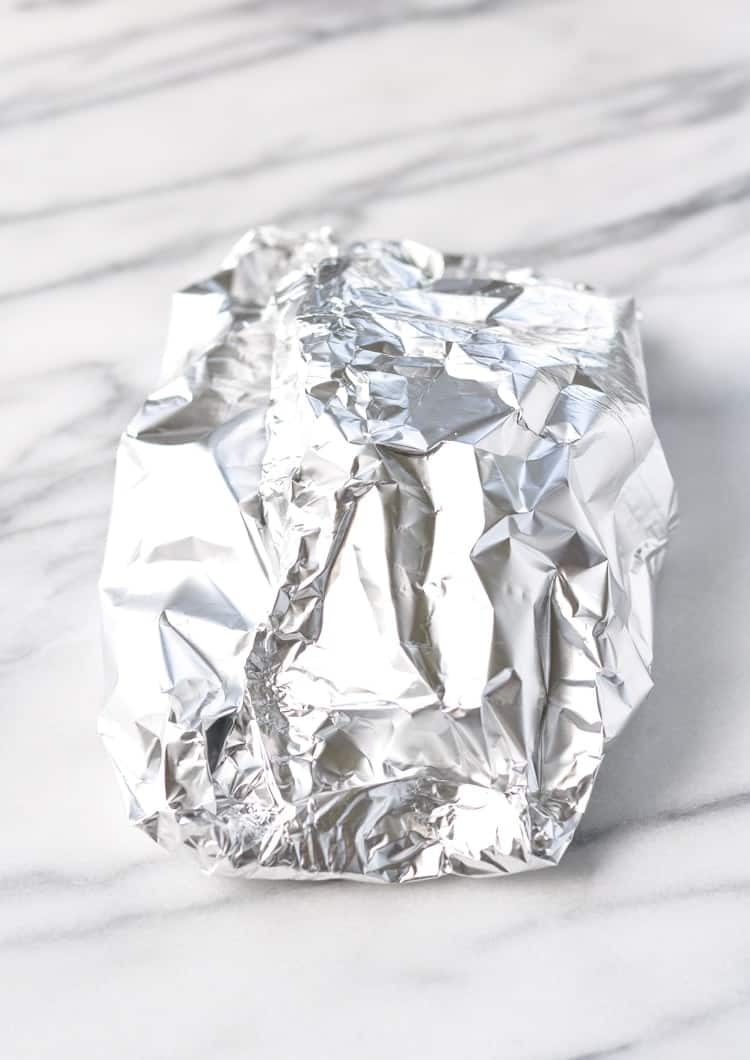 Mediterranean Salmon in Foil Packets sitting on a marble surface