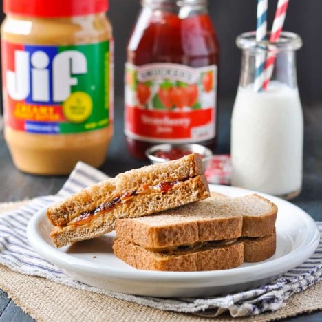 A peanut butter and jelly sandwich on a plate