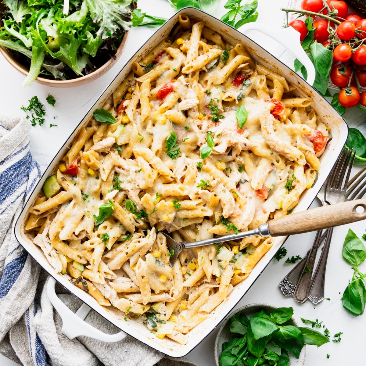 Square overhead shot of dump and bake summer pasta in a white dish.