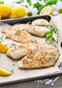 A close up of baked Tilapia on a baking tray